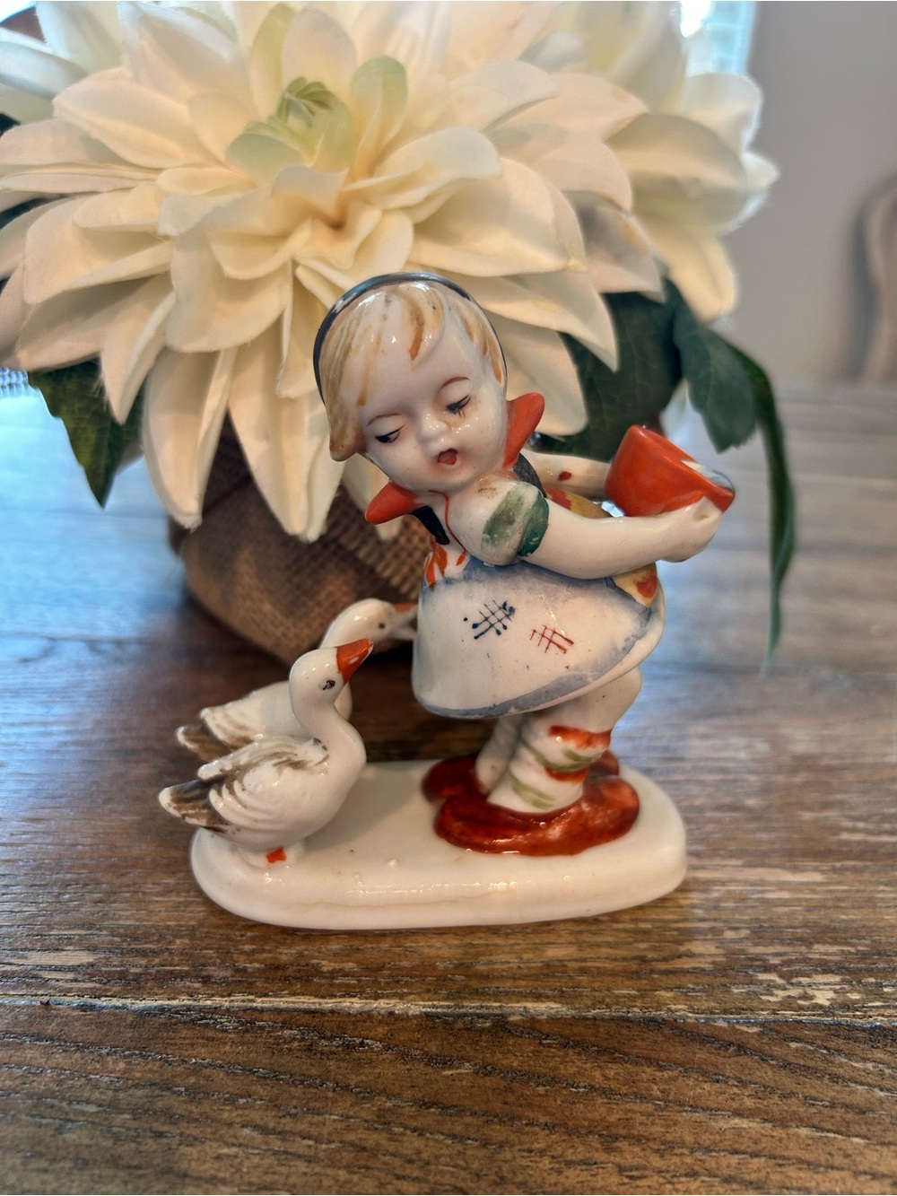 Vintage figurine girl with geese